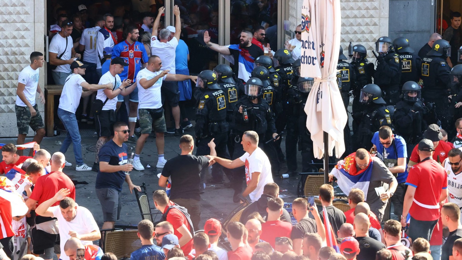 Riot cops clash with fans in violent scenes before Serbia & Denmark's 0-0 draw