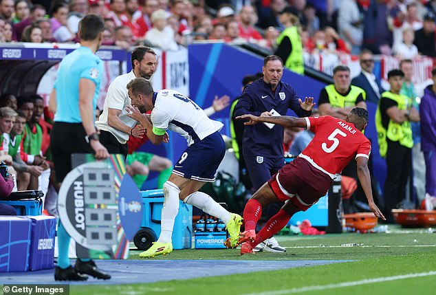 Harry Kane is sent FLYING into Gareth Southgate and collides with the England dugout during Switzerland quarter-final – before being hooked just moments later with penalties looming